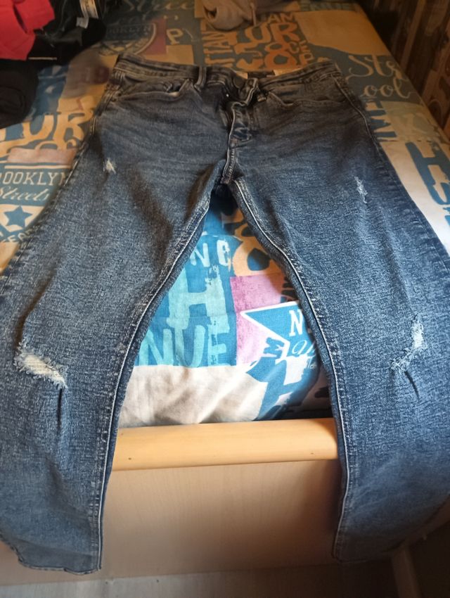 Pantalones vaqueros desgastados azules