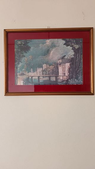 Quadro con cornice dorata e passepartout rosso