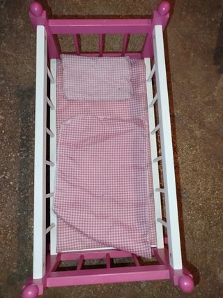 Cuna de muñecas rosa y blanca