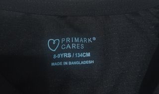 Camiseta negra  manga corta de Primark 8-9 años.