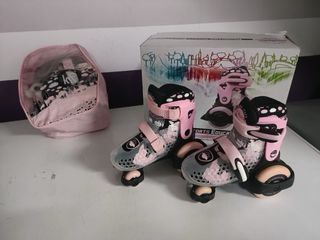 Patines rosas y bolsa para patinar