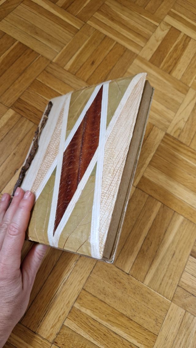 Album fotografico con decorazioni naturali