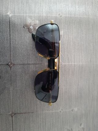 Occhiali da sole Police uomo neri e oro