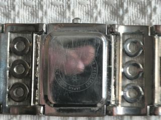 Reloj brazalete acero con detalles rojos
