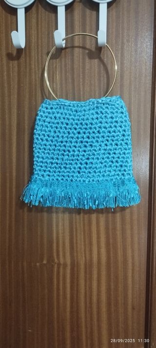 Bolso de mano azul turquesa con flecos
