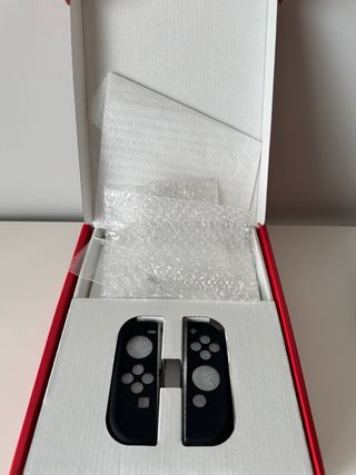 Nintendo Switch OLED + funda + tarjeta de 128gb