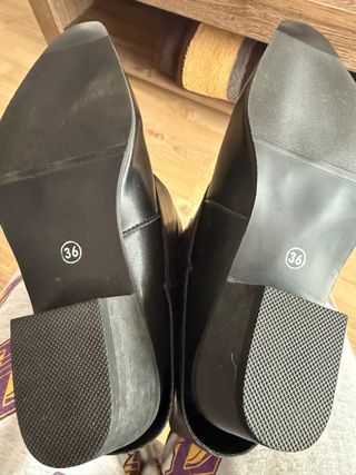 Botas altas negras con hebillas