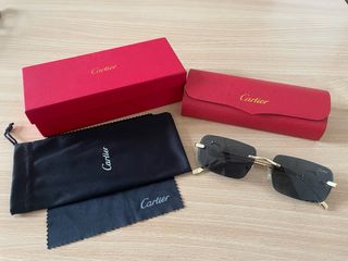 Occhiali da sole Cartier neri e oro