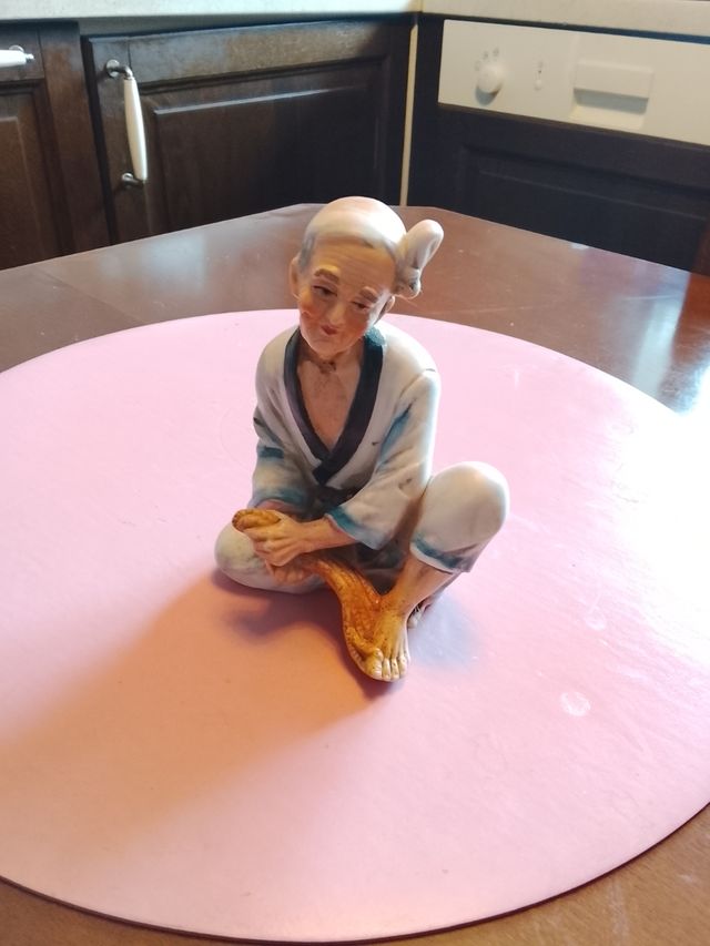 Figura de pescador de cerámica