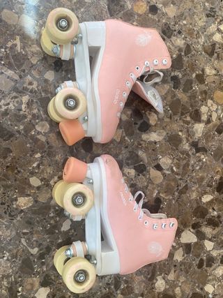 Patines 4 Ruedas. Marca: Oxelo.  Talla 35 - Rosas.