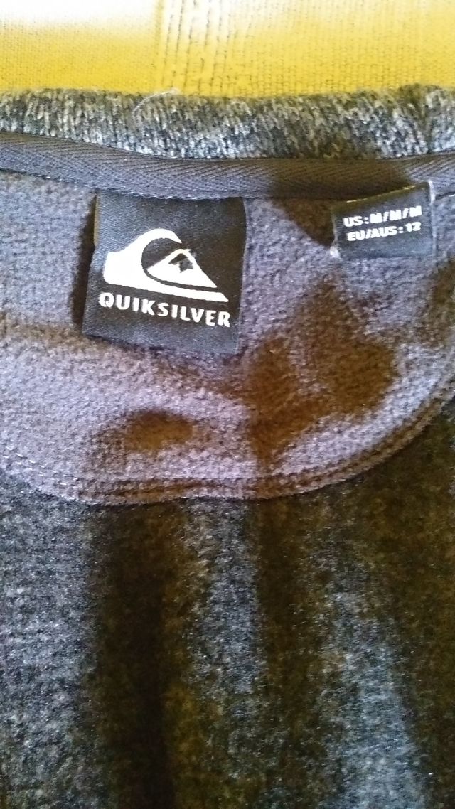 Chaqueta Quiksilver gris y negra mujer