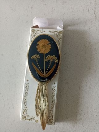 Espejo de mano dorado ovalado