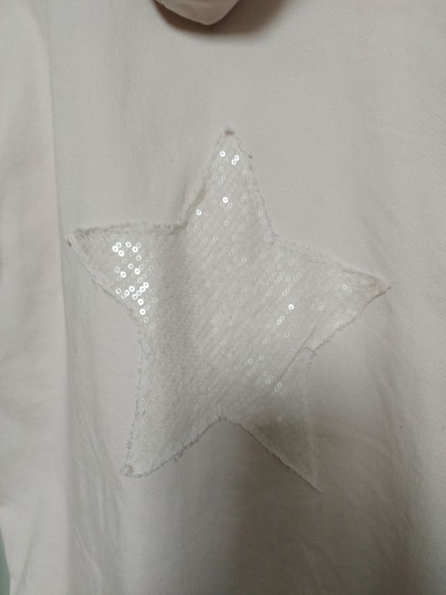 Chaqueta rosa con estrella de lentejuelas