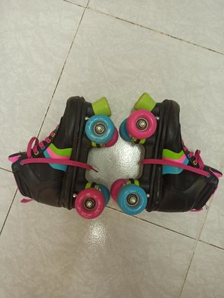 Patines de ruedas en paralelo niña rosa y negro