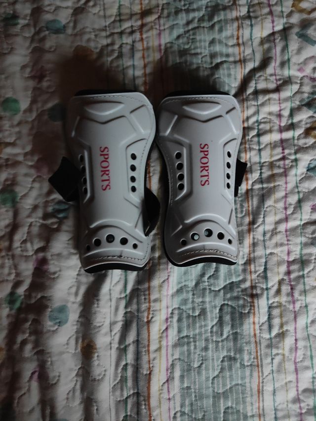 Espinilleras deportivas blancas niño