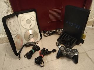 PlayStation 2 con juegos y mando