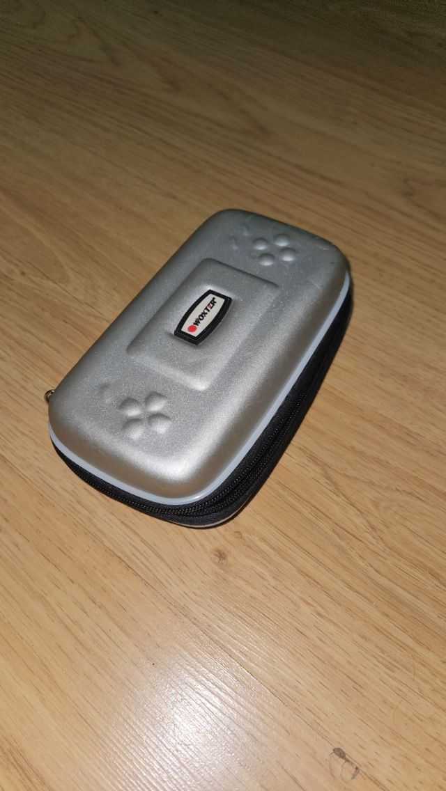 Custodia Woxter per console