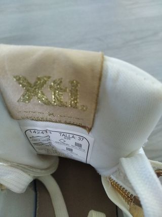 Zapatillas blancas y doradas mujer