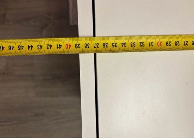 Mueble TV blanco y negro compuesto por 3 módulos