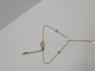 Pulsera esclava con estrellas doradas