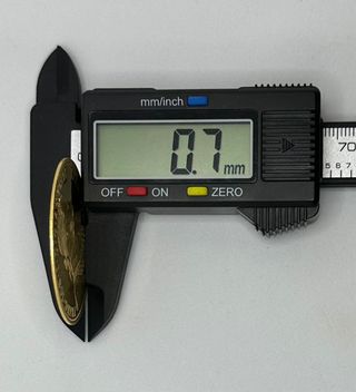 Moneda de oro de 23k, 13.97 g.