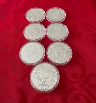 Lote 7 monedas chapadas en plata 
REPLICAS !