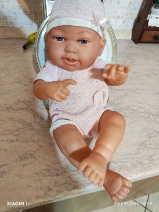 Bambolotto neonato rosa con cappellino