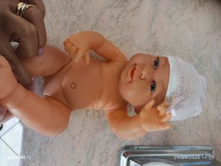 Bambolotto neonato rosa con cappellino