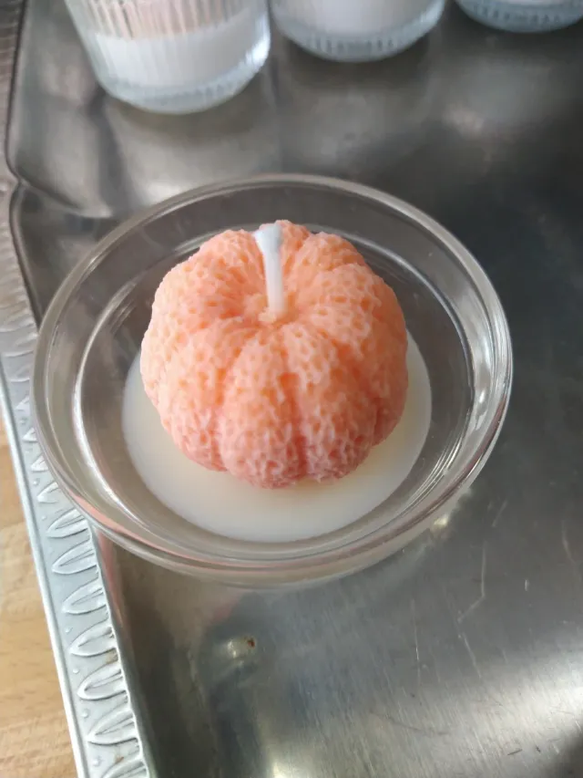 Candela a forma di mandarino