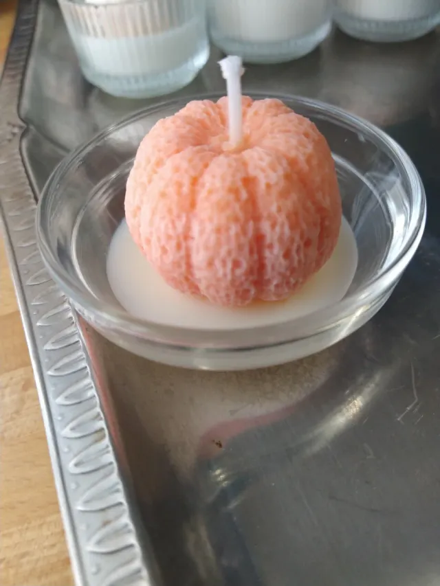 Candela a forma di mandarino