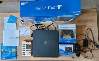 PS4 Pro 1TB + Cargador + 2 Juegos