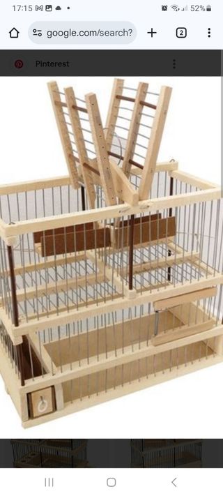 Jaula para pájaros de madera y metal antigua.