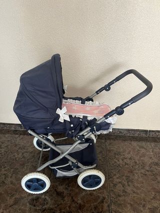 Cochecito de muñecas azul con estrellas