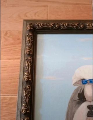 Cuadro de la raza Shih tzu con marco de madera.