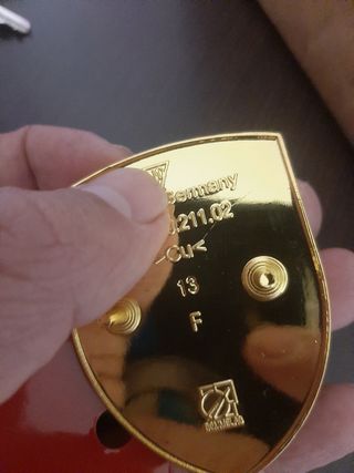 Emblema Porsche capo 
