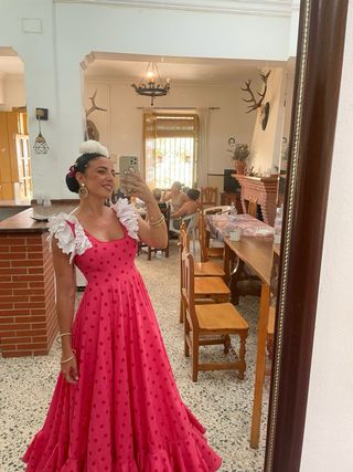 Traje de flamenca rosa con volantes