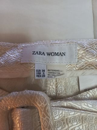 Pantalones dorados de campana con cinturón