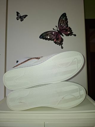 Tenis botin Tenth decimas