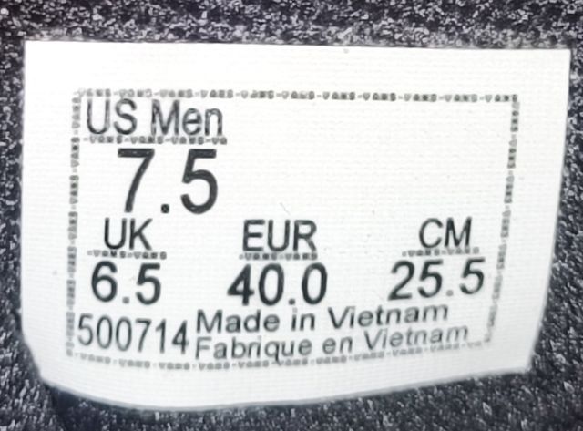 Zapatillas Vans grises y negras