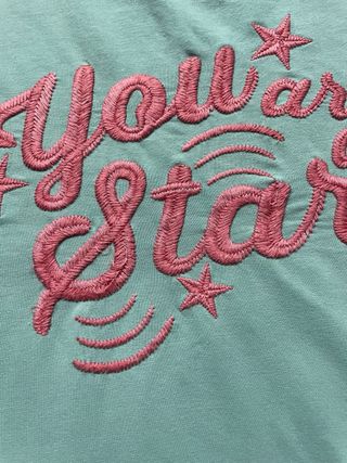 Vestido turquesa con volantes y estampado
