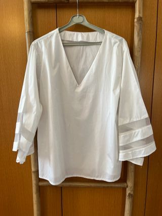 Blusa blanca manga larga con transparencias