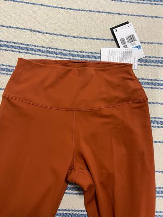 Mallas Nike naranjas largas