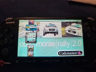 Sony PSP 3003 Negra + 4 UMDs
