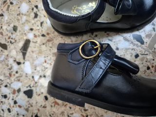 Zapatos negros niña lazo y hebilla