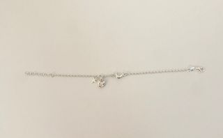 Pulsera plata con mariposa, luna y estrella