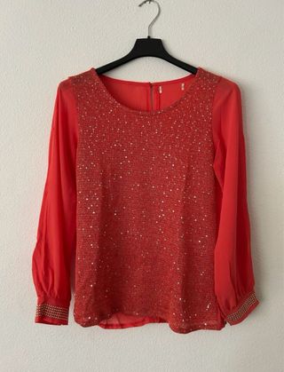 Blusa naranja con lentejuelas
