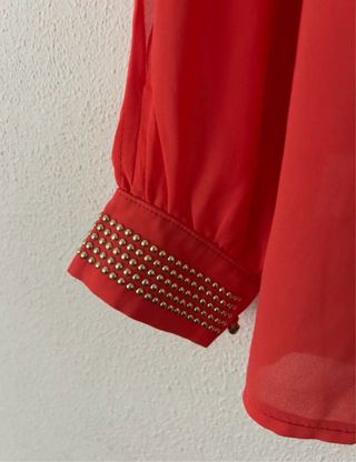 Blusa naranja con lentejuelas