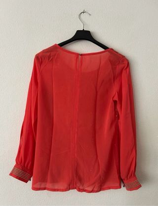 Blusa naranja con lentejuelas