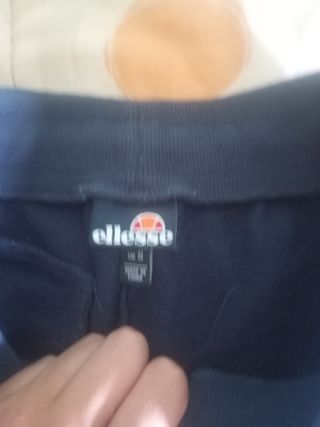 Chándal Ellesse azul con detalles naranjas