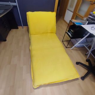 Sillón cama amarillo de tela